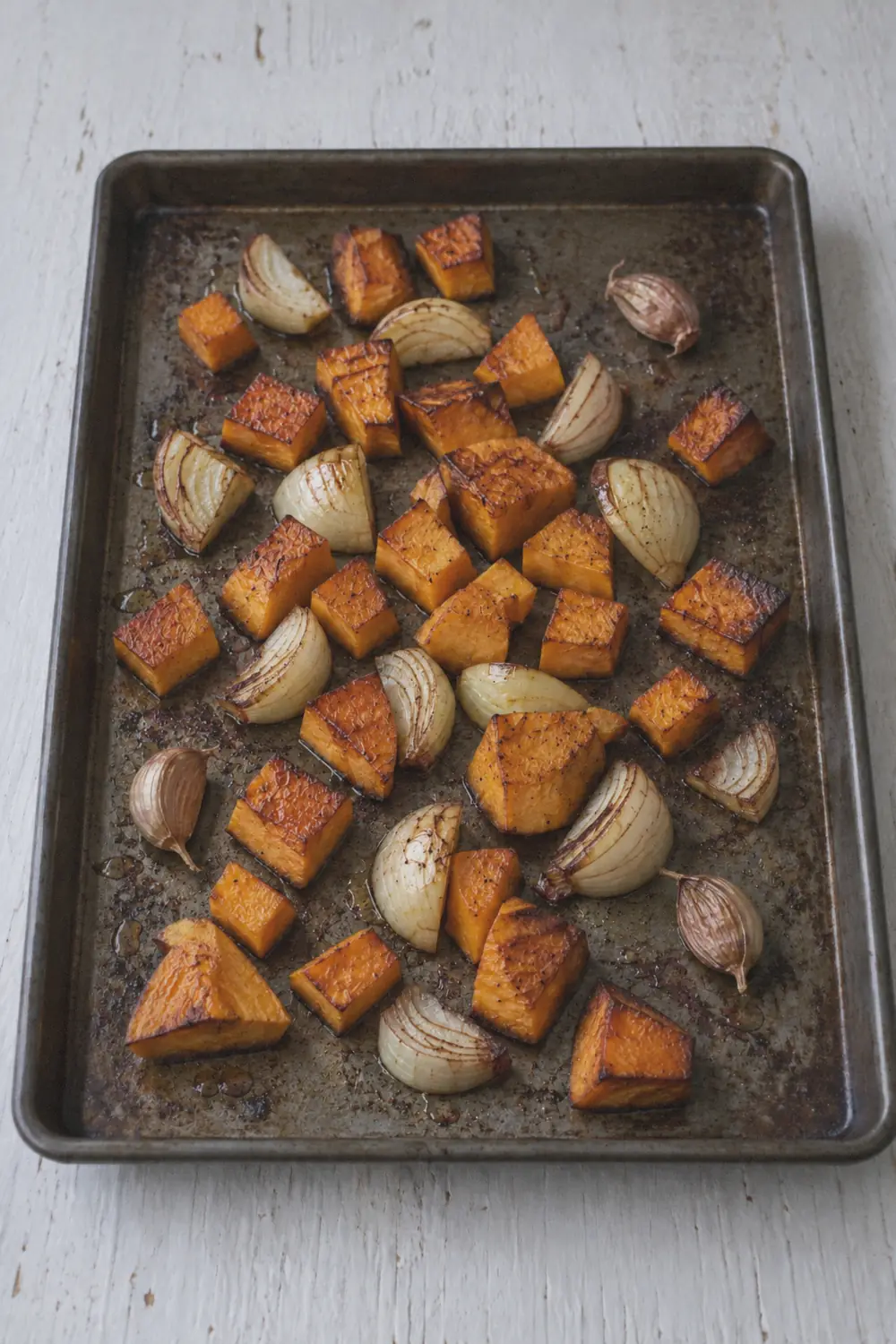 Roasted butternut squash on a baking sheet