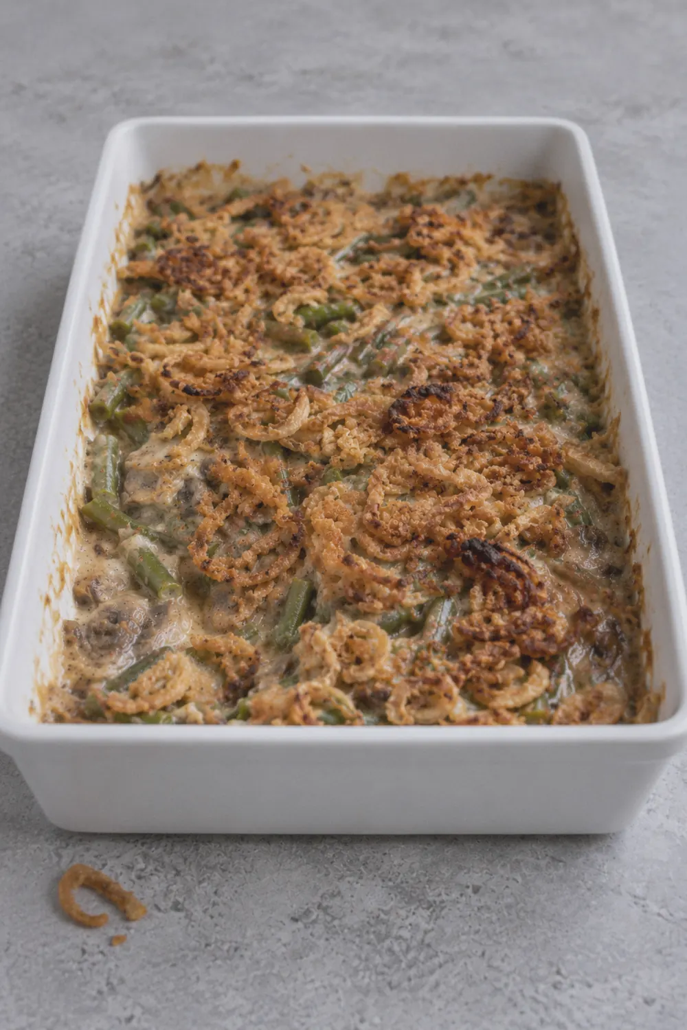 Finished green bean casserole topped with crispy fried onions