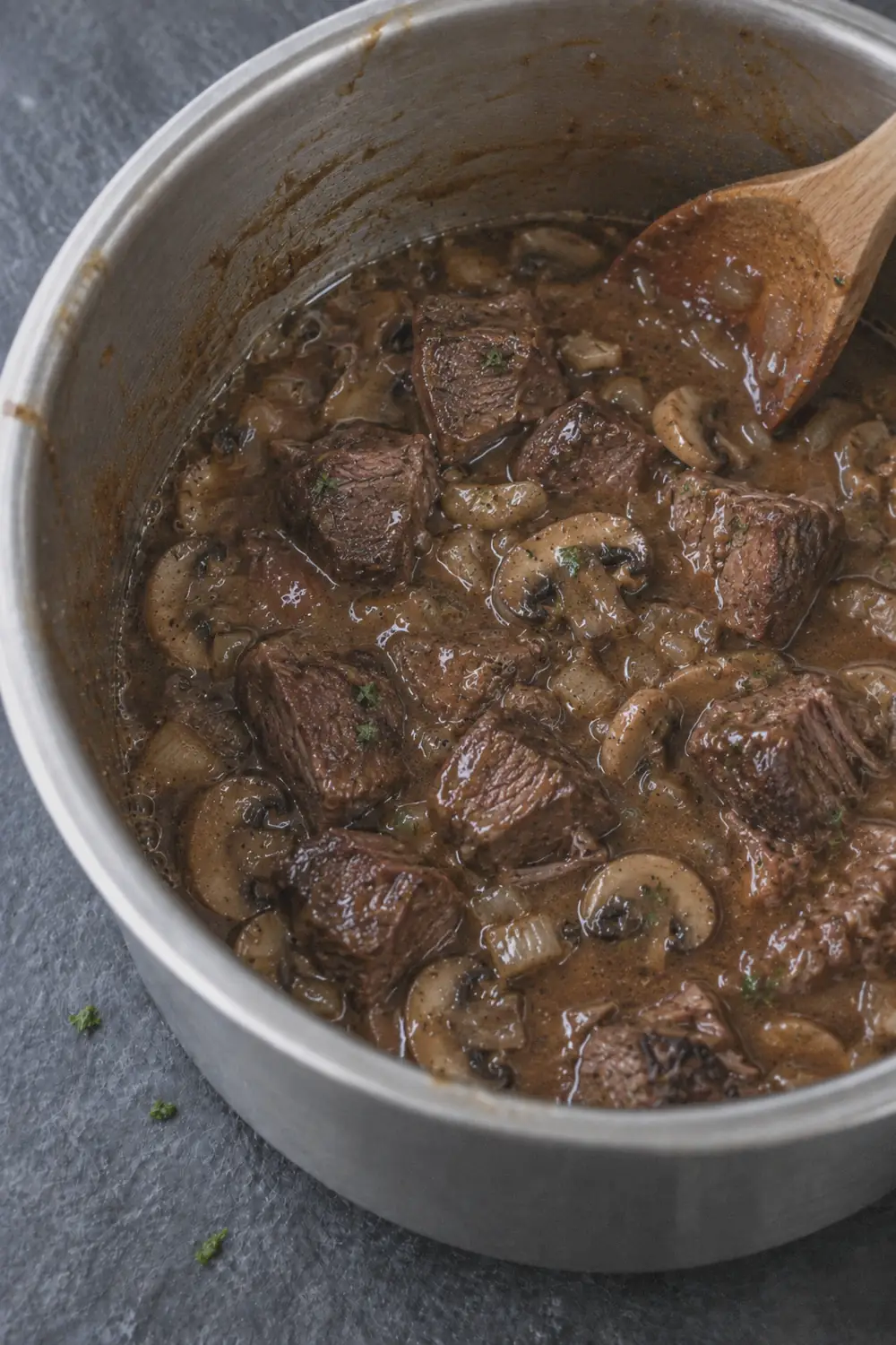 Thickening the gravy with a cornstarch slurry