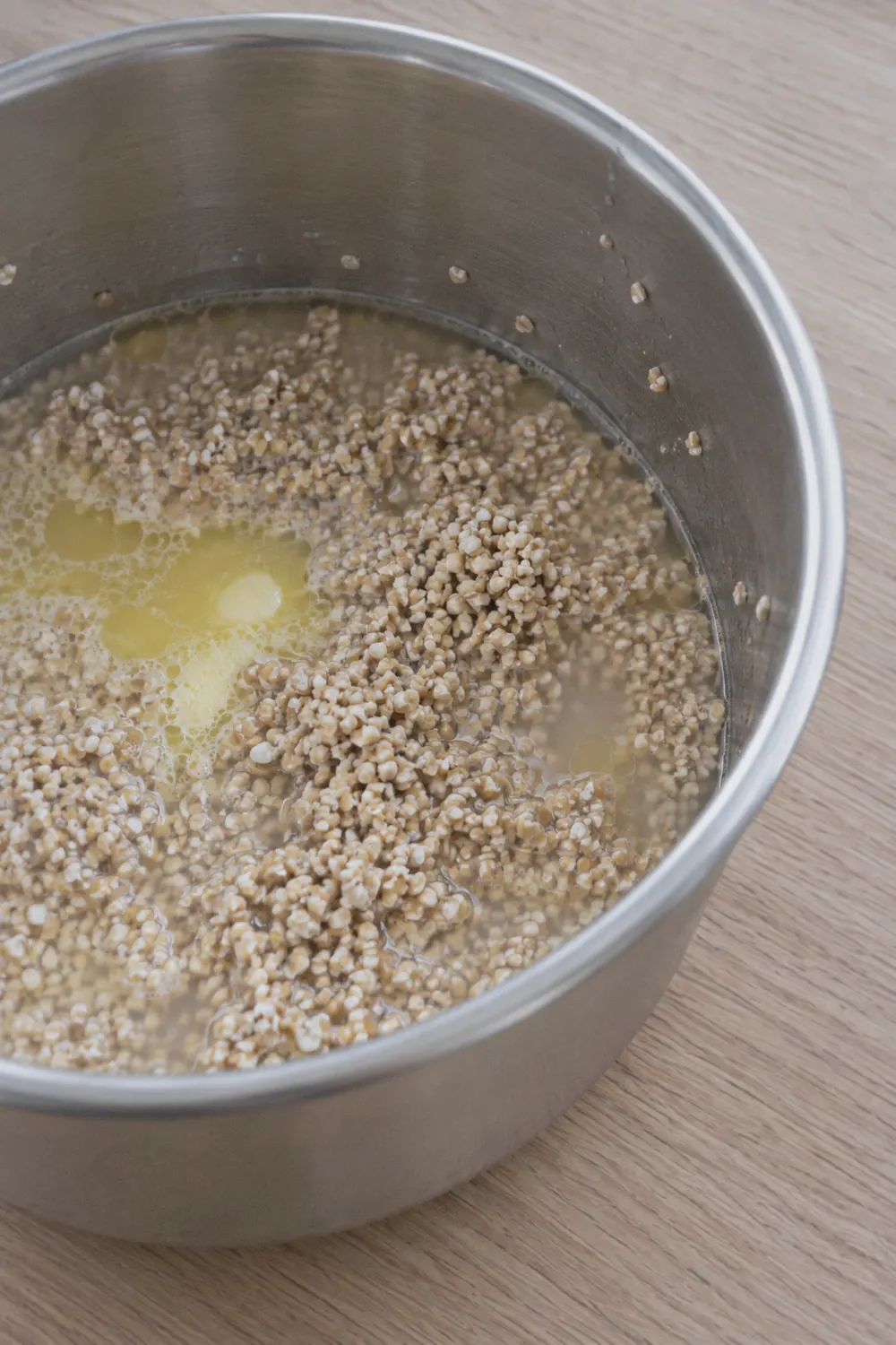 Steel-cut oats with butter and water in the Instant Pot insert before cooking